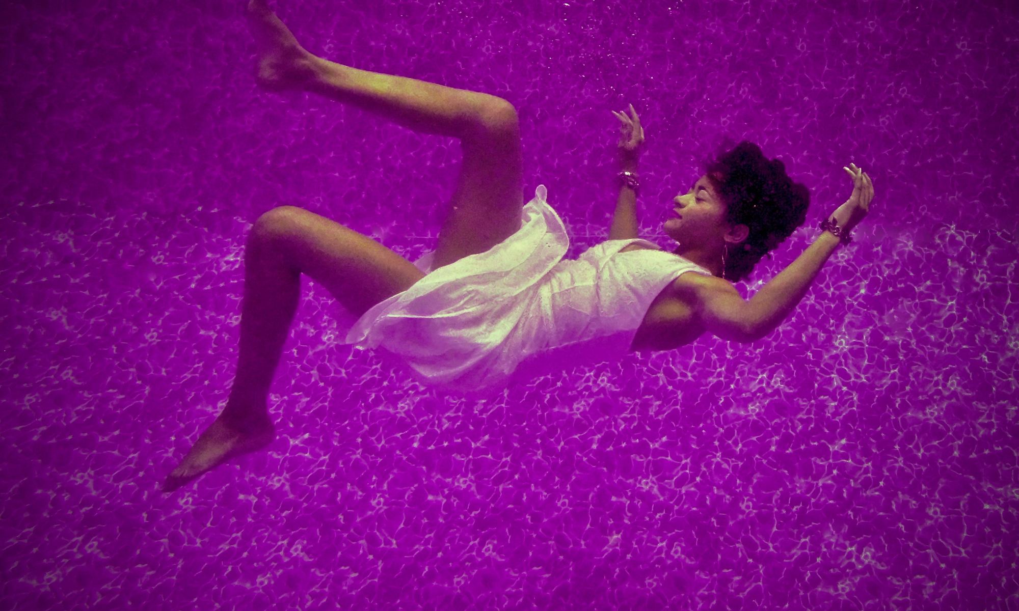 Black woman falling on purple surface in dream
