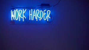 Nobody cares work harder blue neon sign on wall 